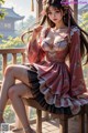 A woman in a pink dress sitting on a wooden bench.